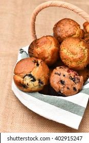 Basket Of Fresh Baked Muffins. Blueberry, Cranberry, Lemon Poppy Seed Are Among The Varieties Shown.