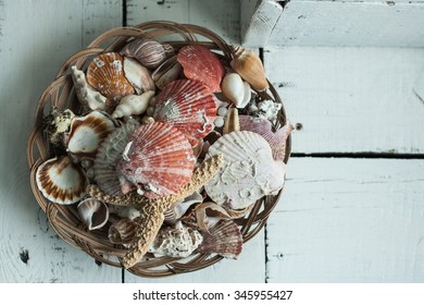 Basket full of different seashells - Powered by Shutterstock