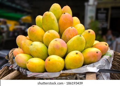 Basket full of ripe mangoes