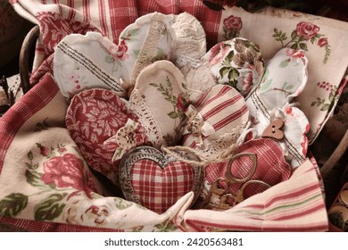 A basket full of vintage style handmade heart decors made of various old fabrics  - Powered by Shutterstock