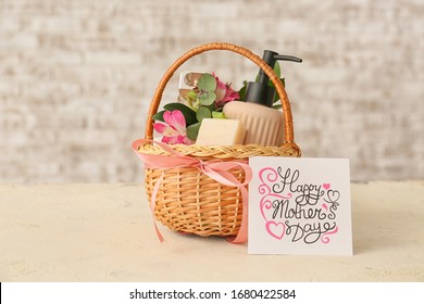 Basket With Gifts For Mother's Day On Table
