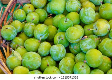 Basket Of Green Gage Plums (reine Claude) At A Farmers Market