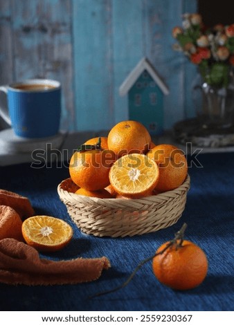A basket of oranges on the table with complementary colors photography concept 