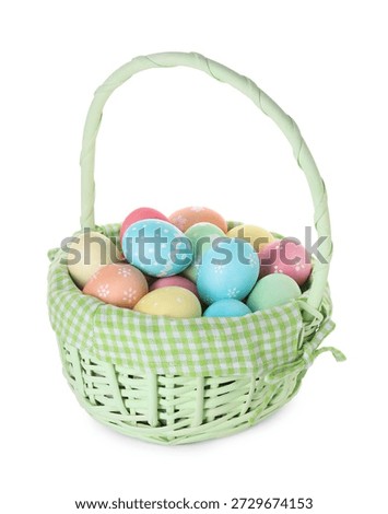 Basket with painted Easter eggs isolated on white