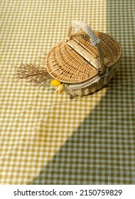 Basket Picnic On Yellow Tablecloth, Vertical Background.