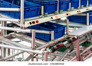 basket or plastic box container on roller rack or aluminum shelf with electronic display smart module system for management – control or operate stock such as quantity and data information etc