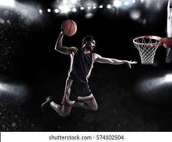 Basket Player Throws The Ball At The Stadium