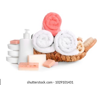 Basket and soft towels   toiletries white background