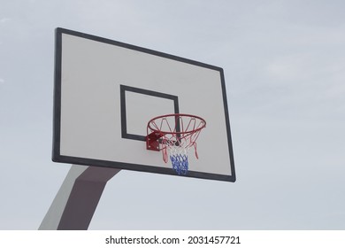 Basketball backboard against the blue sky background