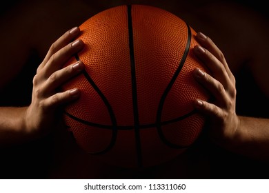 Basketball ball in male hands