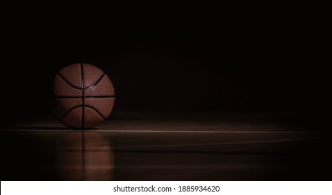 Basketball ball on black background. Team sport concept