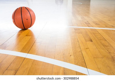 Basketball ball over floor in the gym 