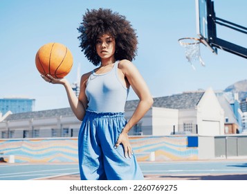 Basketball court, fashion and portrait of black woman in city with attitude, urban style and trendy clothes. Sports, fitness park and girl model outdoors with ball for leisure, confident and stylish