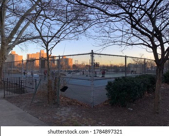 
Basketball Court In A Harlem Park On A Cold Winter Sunset