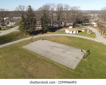 A Basketball Court At A Small Town Community Park