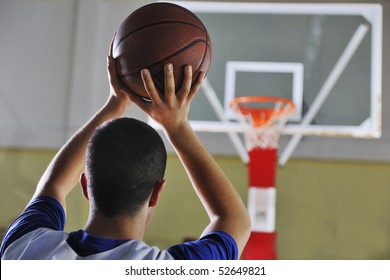 Basketball Game Playeer Shooting On Basket Indoor In Gym