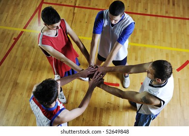 Basketball Game Players Holding Together As Team Representing Team Spirit