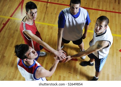 Basketball Game Players Holding Together As Team Representing Team Spirit