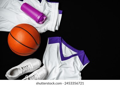 Basketball Gear Prepared for an Evening Training Session on a Dark Backdrop - Powered by Shutterstock