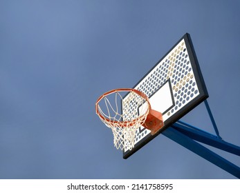 A Basketball Goal Post Installed Outdoors.