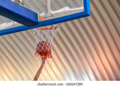 Basketball going through the basket