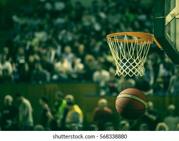 Basketball Going Through The Hoop At A Sports Arena