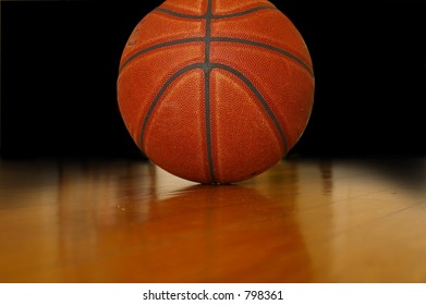 Basketball in the gym in dim light - Powered by Shutterstock