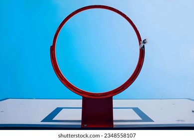 a basketball hoop with blue sky 
