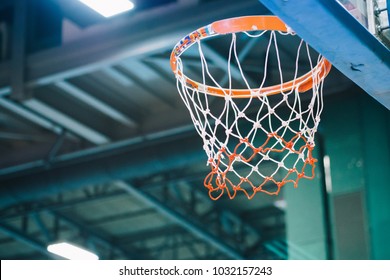 A Basketball Hoop And Net Inside An Indoor Sport Arena