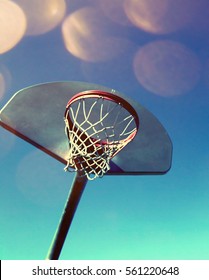 Basketball hoop and net on a colourful background