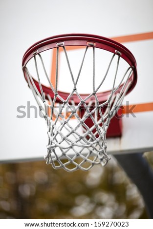 Similar – Foto Bild roter Basketballplatz mit weißen Linien auf der Straße