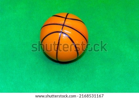 Basketball, isolated against green background