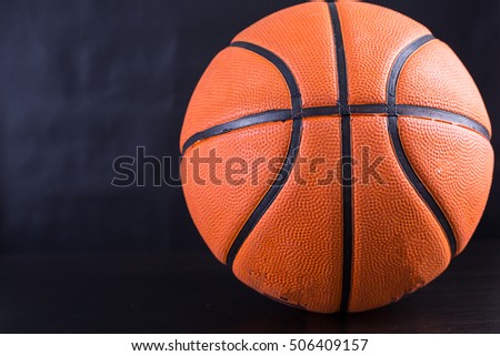 Basketball item ball with black background.