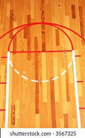 Basketball Key Painted On Hardwood Floor In Gymnasium. Closeup Of The Court From A High Angle.Great For Final Four And March Madness Concepts