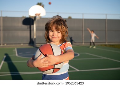 Basketball Kids Training Game. Kid Playing Basketball With Basket Ball. Child Posing With A Basketball Ball