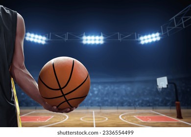 Basketball male player holding a ball - Powered by Shutterstock