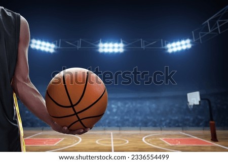 Basketball male player holding a ball