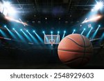 Basketball on the floor. Modern Basketball Arena with Rings with Spotlights, Creative Idea. Tournament and Win. Basketball game with full hall of fans on dark background. Basketball Championship. 