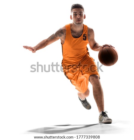 Basketball player in action with a ball isolated on white background. Dribbling