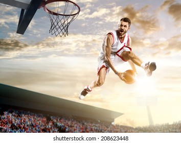 Basketball Player In Action On Background Of Sky And Crowd 