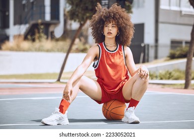 Basketball player with funky, confident and cool attitude ready for competition, game or fit training match on a sports court. Beautiful black woman, healthy athlete and motivation female with afro - Powered by Shutterstock