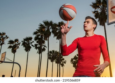 Basketball Player. Hand Spinning Basket Ball. Balancing Basketball On Finger. Sports And Basketball.