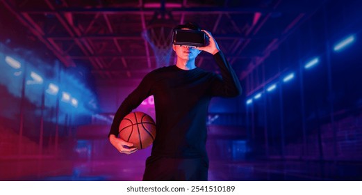 Basketball player holding basketball hologram at futuristic sport arena. Energetic athlete or sport person practicing basketball skill by using augmented reality technology. Innovation. Ingenuity. - Powered by Shutterstock