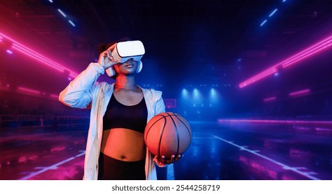 Basketball player holding basketball hologram at futuristic sport arena. Energetic athlete or sport person practicing basketball skill by using augmented reality technology. Innovation. Ingenuity.. - Powered by Shutterstock