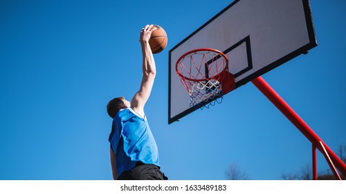 Basketball Player Makes Slam Dunk