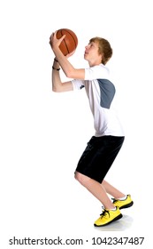 The Basketball Player Makes A Throw. The Concept Of Youth Sports, Fitness, Healthy Lifestyle. Isolated On White Background.