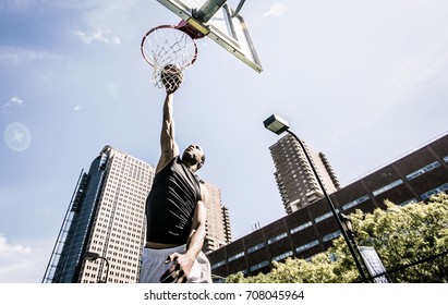 Basketball Player Making Huge Slam Dunk