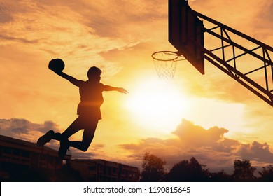 Basketball player performs a slam dunk - Shutterstock ID 1190815645