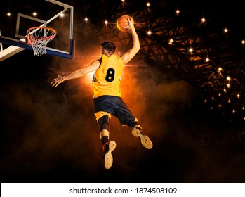 Basketball player players in action. Basketball concept on dark background - Powered by Shutterstock