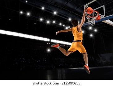 Basketball player players in action on arena background - Powered by Shutterstock